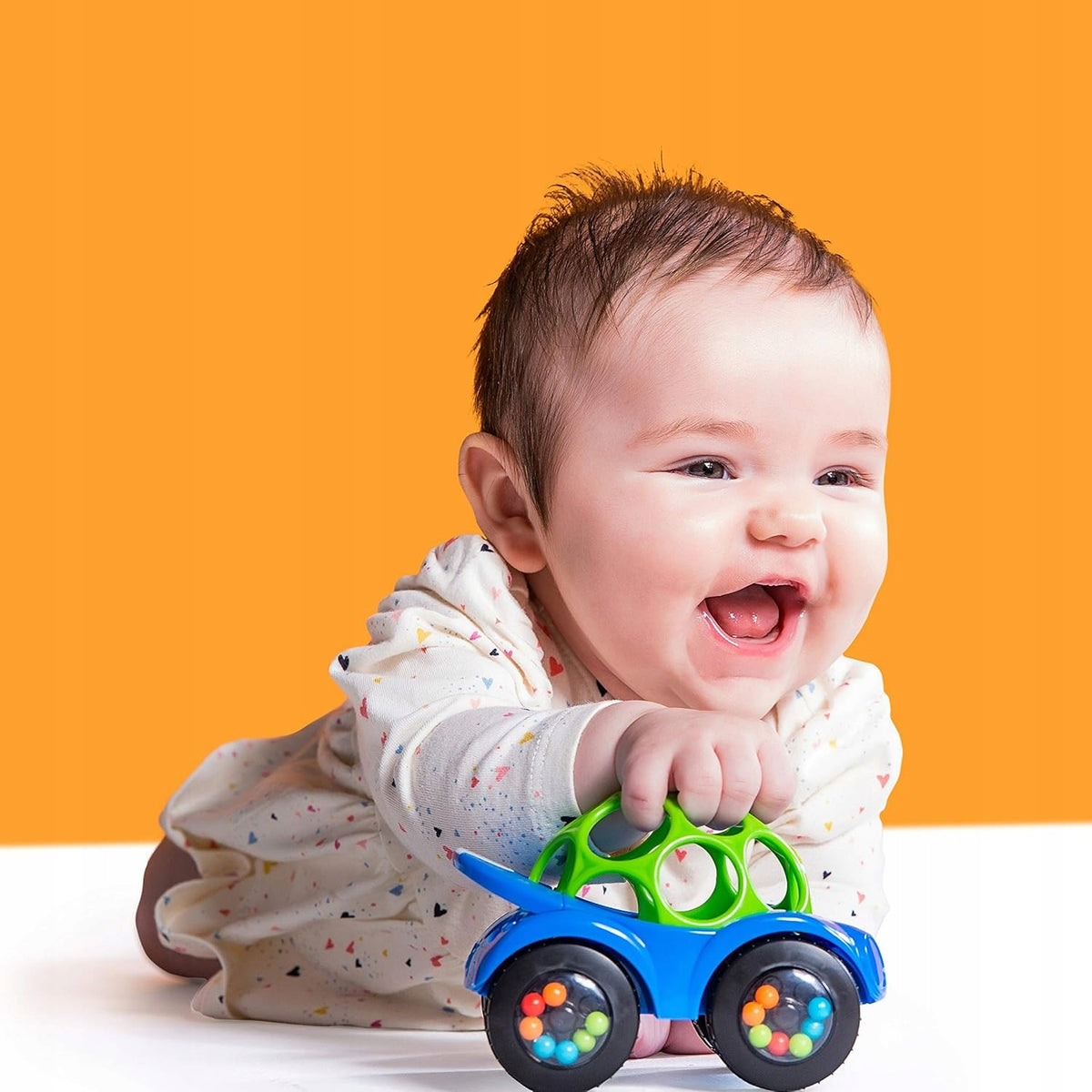BRIGHT STARTS Oball Rattle & Roll jeżdżący samochód z grzechotką, niebiesko-zielony, dla niemowląt 3 m+