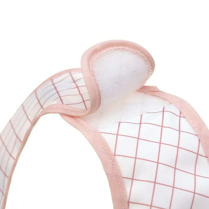 Babero de plástico LASSIG con velcro y bolsillo x2 6-24 meses
