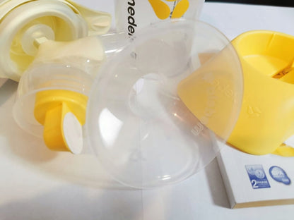 MEDELA Harmony 005.2052 laktator ręczny 2-fazowy U, żółty, z lejem i akcesoriami